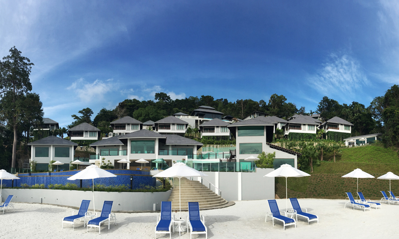 Beach chalets surrounded by lush greenery
